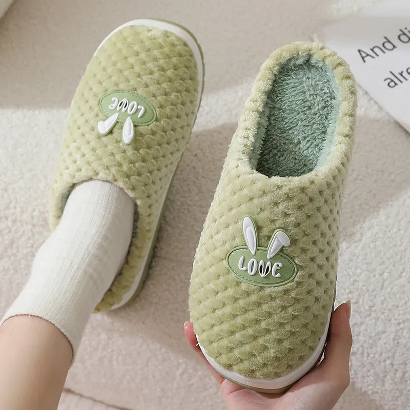 Women's rabbit plaid artificial fur slippers with a thick rubber sole in apricot colour.