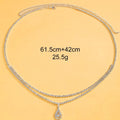 Gold waist chain with water drop pendant and rhinestone tassel measuring 115cm