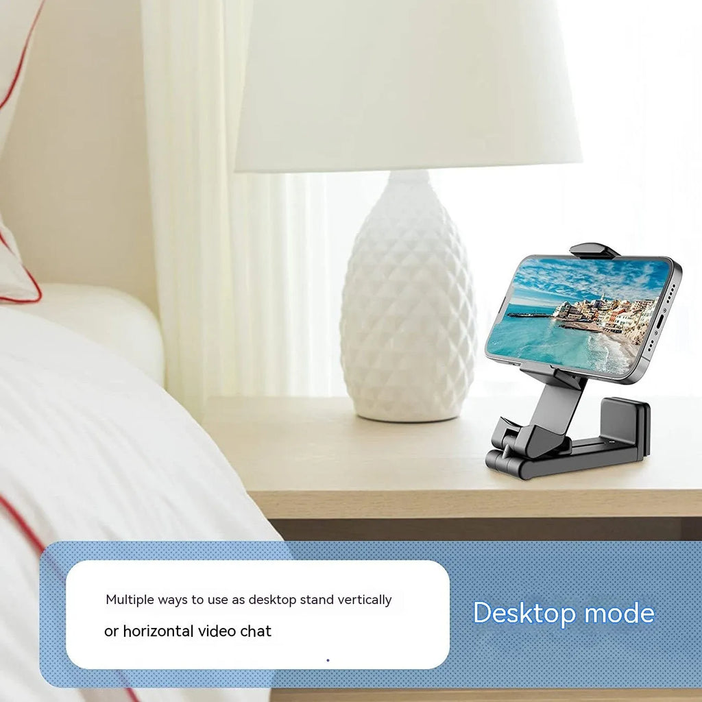 Black foldable rotating phone holder showing adjustable angles on a desk