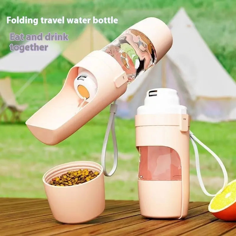 Grey 2-in-1 travel dog water bottle and food dispenser with lanyard attached, showing separate water and dry food compartments