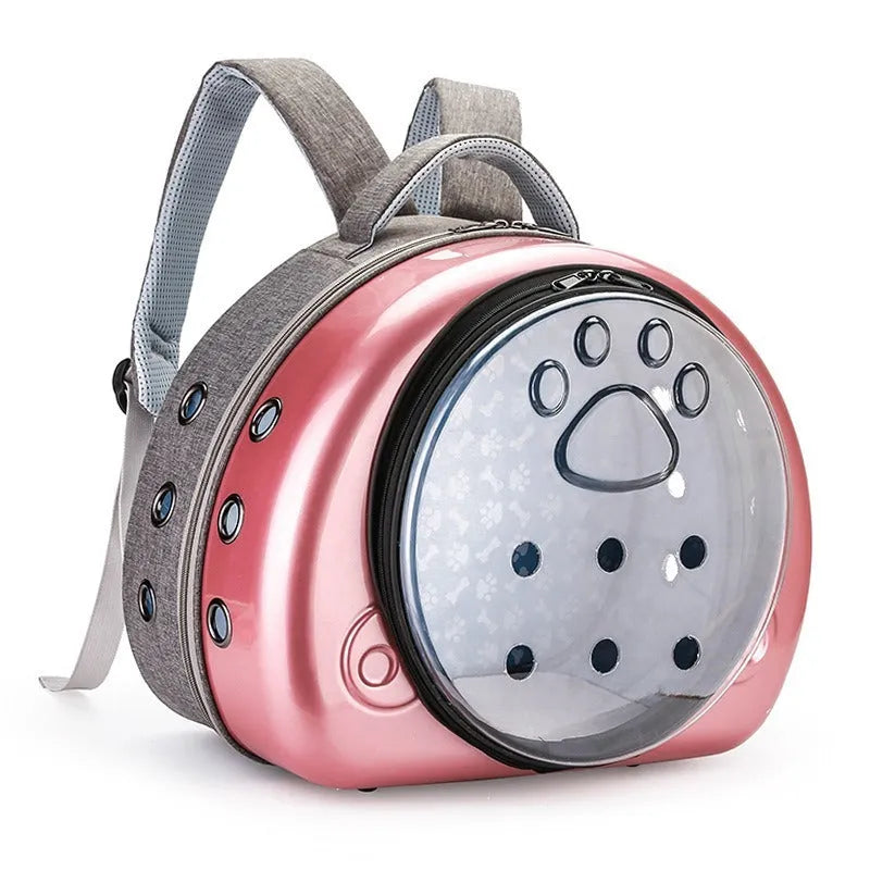 Transparent hard-shell pet carrier bag with metallic rose gold front cover.
