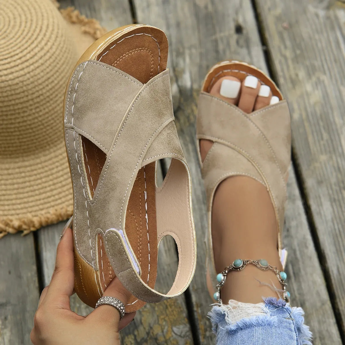 Women's brown Roman platform sandals with an open toe and Velcro strap closure on a rubber sole.