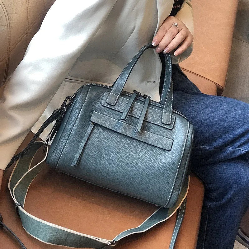 Genuine leather messenger bag with litchi pattern texture in a horizontal square shape.
