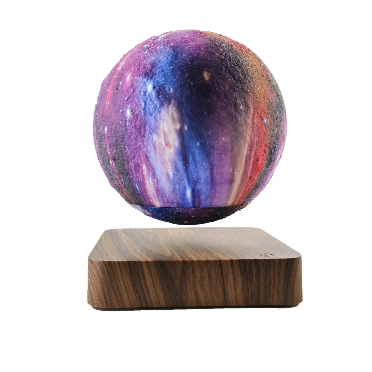 Square walnut coloured base with a levitating, glowing galaxy-patterned moon lamp above it