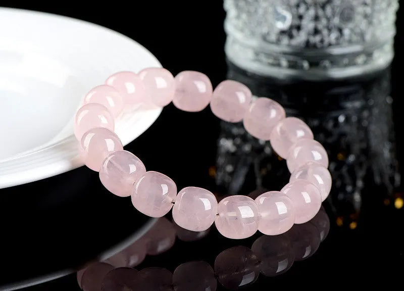 Pink natural crystal bamboo barrel bead bracelet with geometric 11-12mm beads.