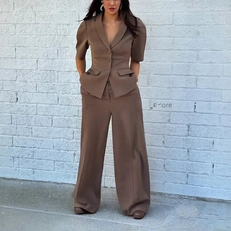 Brown men's slim fit two-piece suit with long sleeve top and trousers on a hanger.