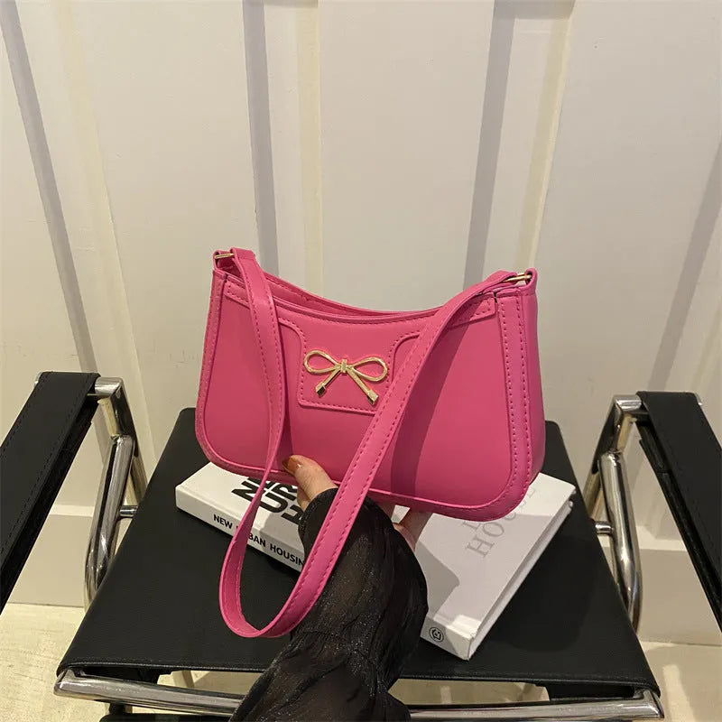 Square PU leather shoulder bag with a single strap and bow decoration in a choice of six colours