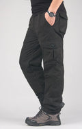 Men's khaki cotton overalls with a wool lining, showing loose fit and straight leg design.