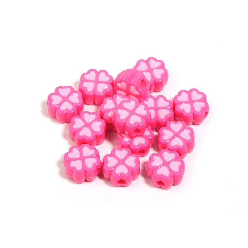15mm acrylic clover-shaped beads with love pattern in multiple pastel colours including rose red, pink, yellow, green, blue, and purple