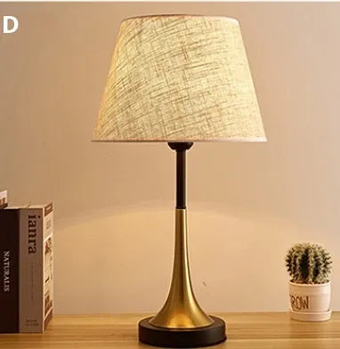 Retro alloy table lamp with LED lighting on wooden surface