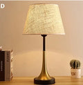 Retro alloy table lamp with LED lighting on wooden surface