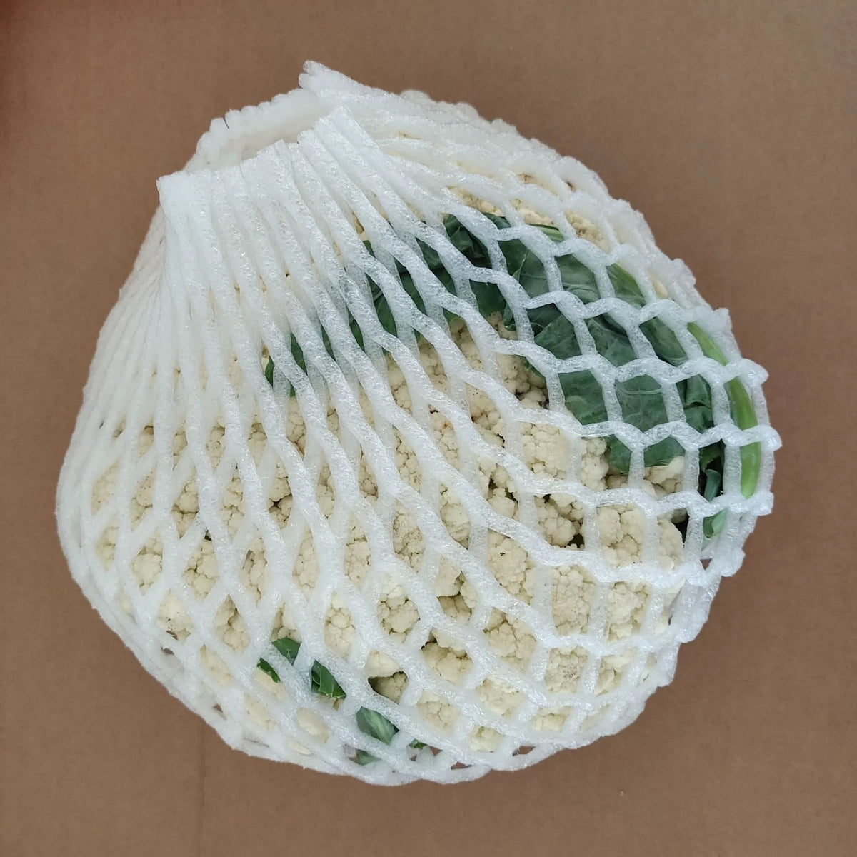 White foam net sleeve for protecting apples pears peaches and citrus fruit from bruising