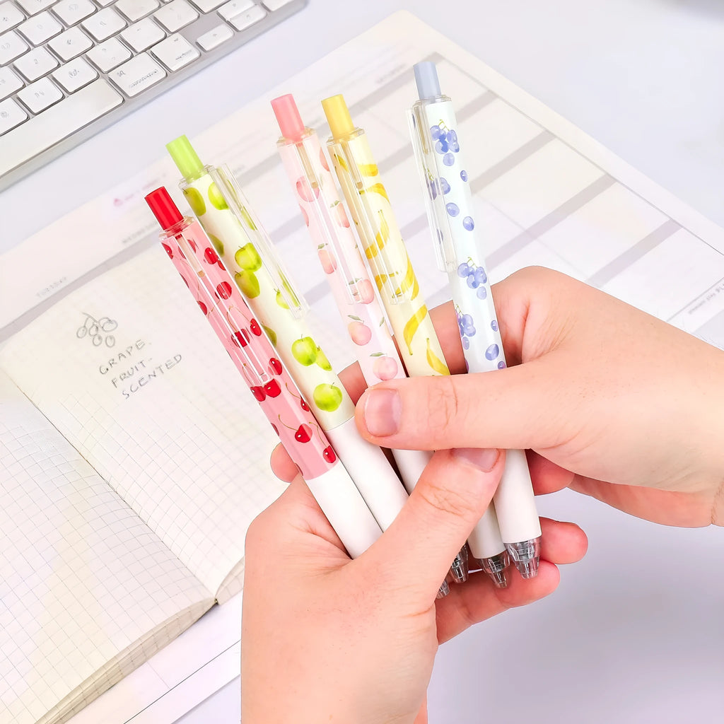 Three fruit scented 0.5mm black ink click pens with plastic barrels and replaceable refills
