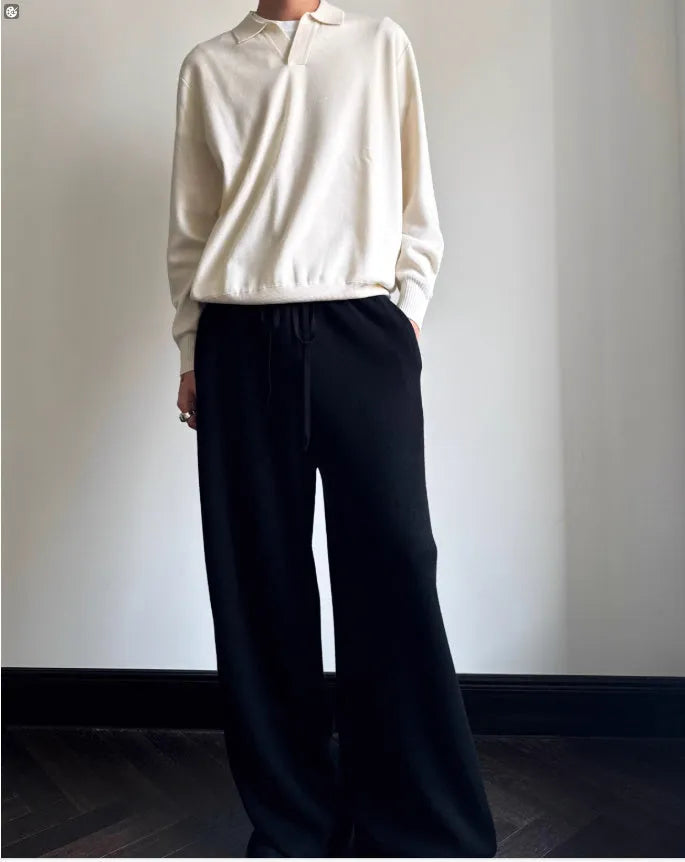 Pure wool polo sweater with lapel collar in loose fit, shown in milky white