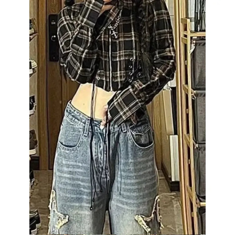 Blue high-waisted wide-leg denim jeans with a straight-leg cut on a model