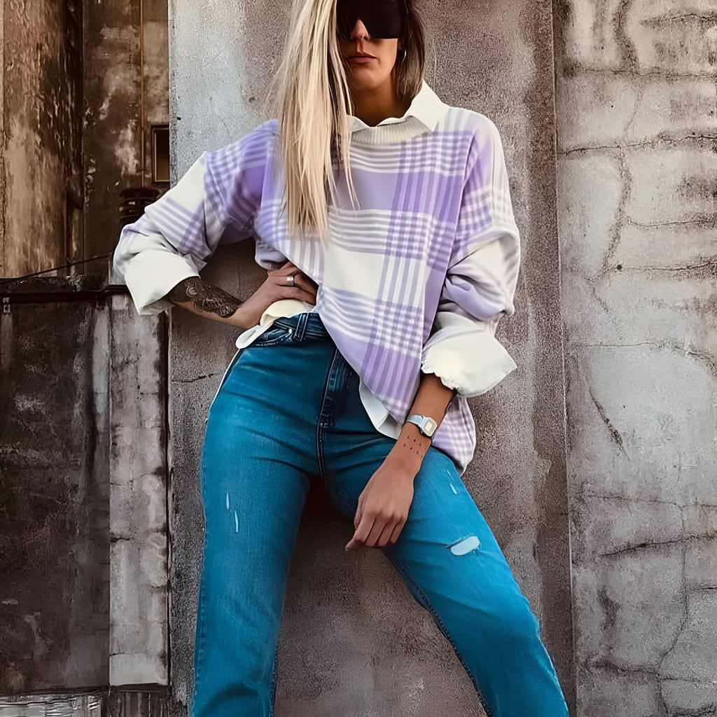 Lilac plaid print loose sweater with ribbed trim at neckline and cuffs on hanger
