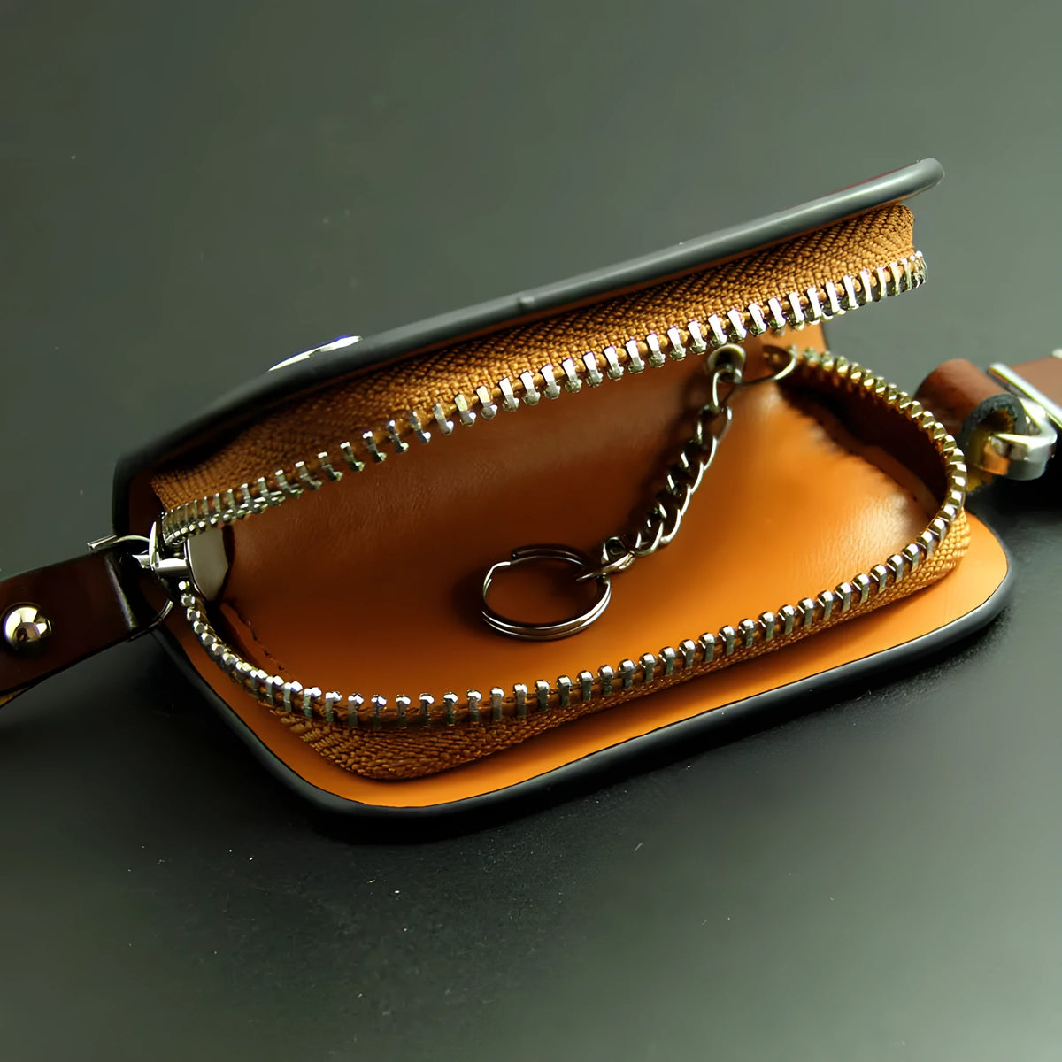V-shaped genuine leather car key case with frosted finish showing black and brown colour options