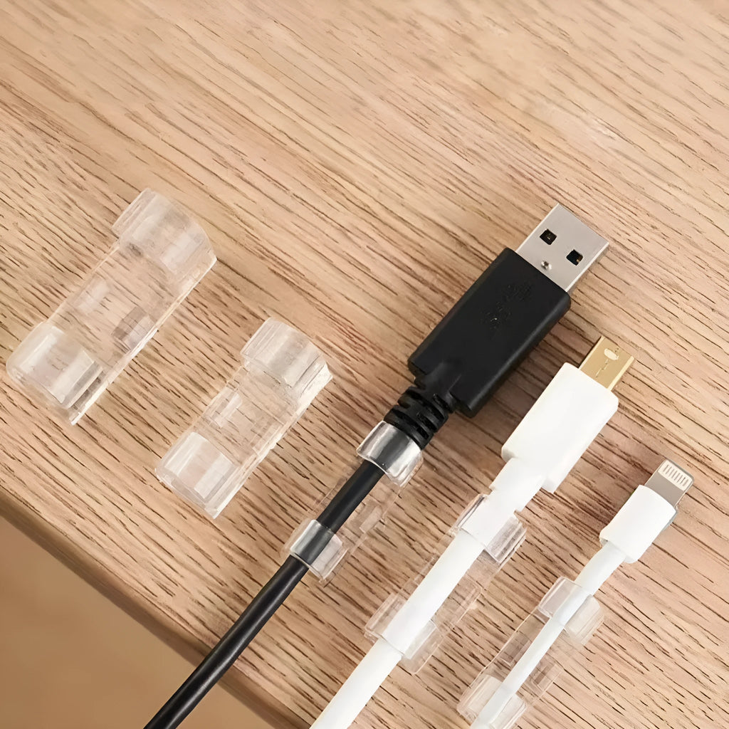 Transparent plastic self-adhesive cable routing snap clips in small, medium, large, and extra large sizes.