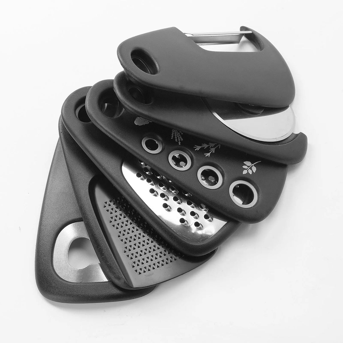 Six stackable kitchen gadget tools and a brush in a colour box, made from stainless steel and polypropylene.