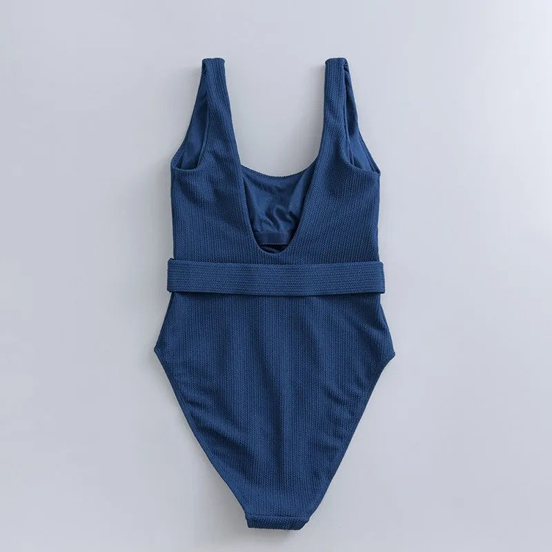 Navy blue one-piece women's swimsuit with triangle slimming shape and chest pads
