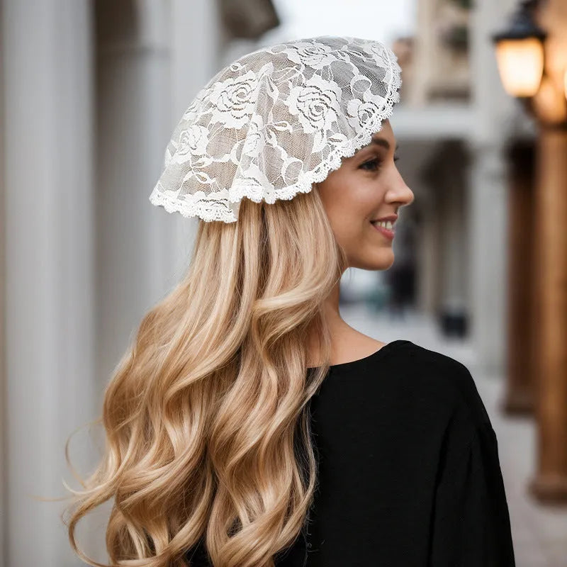 Round black and white floral wedding veil head accessory measuring 30cm.