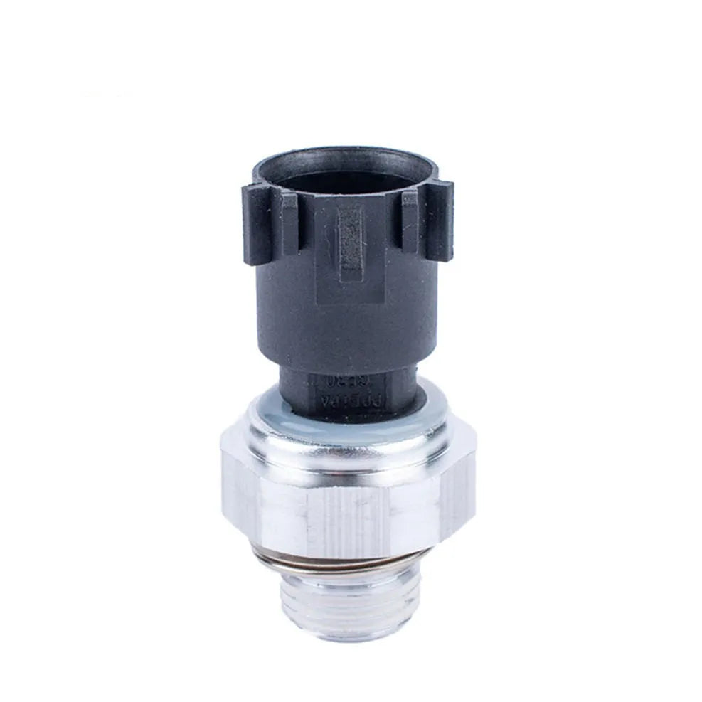 Silver automobile fuel pressure sensor for petrol engine diagnostic testing.