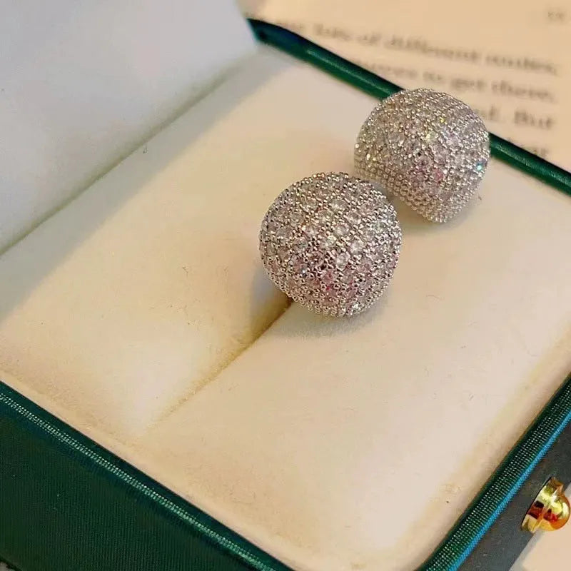 Gold and white women's drop earrings with geometric sphere and diamond-cut golden bean design