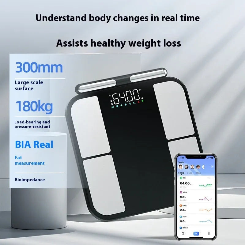 Black electronic body composition scale with tempered glass platform and colour display showing measurements