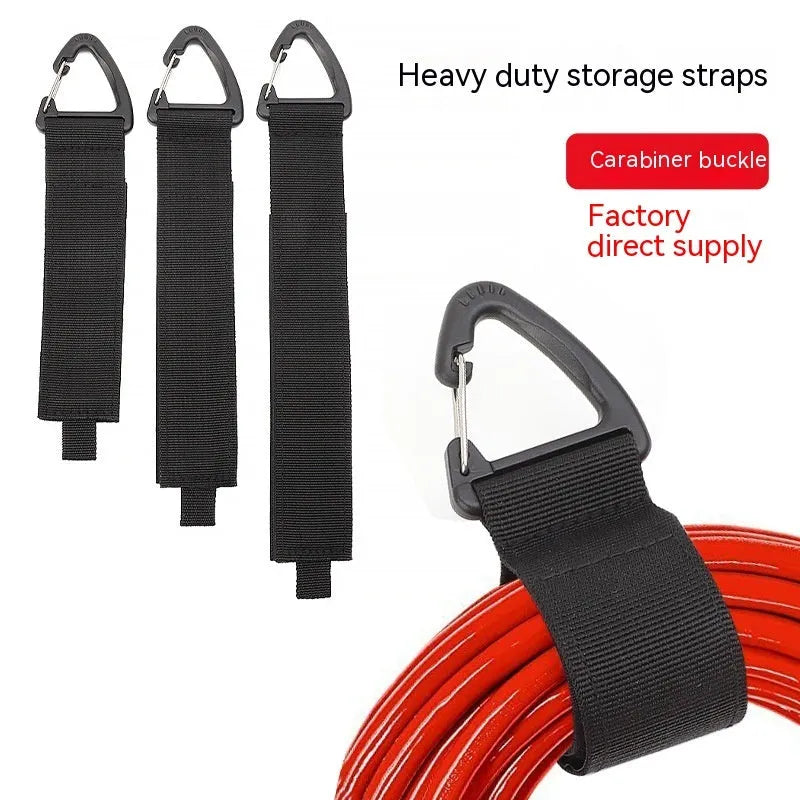 Black heavy gravity climbing storage strap with carabiner hook shown extended vertically