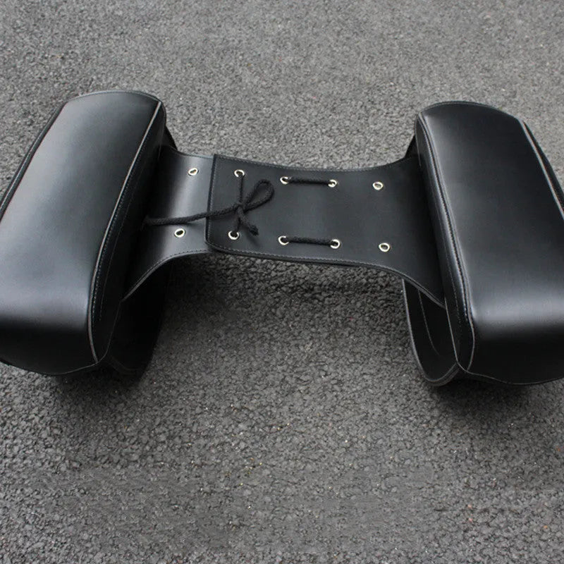 Retro style black PU leather motorcycle side box mounted on a bike, showing its saddle bag shape and size.