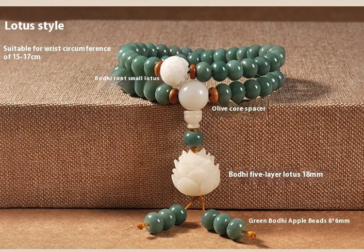 White jade and green sandalwood beaded bracelet with a double ring lotus safety buckle clasp.