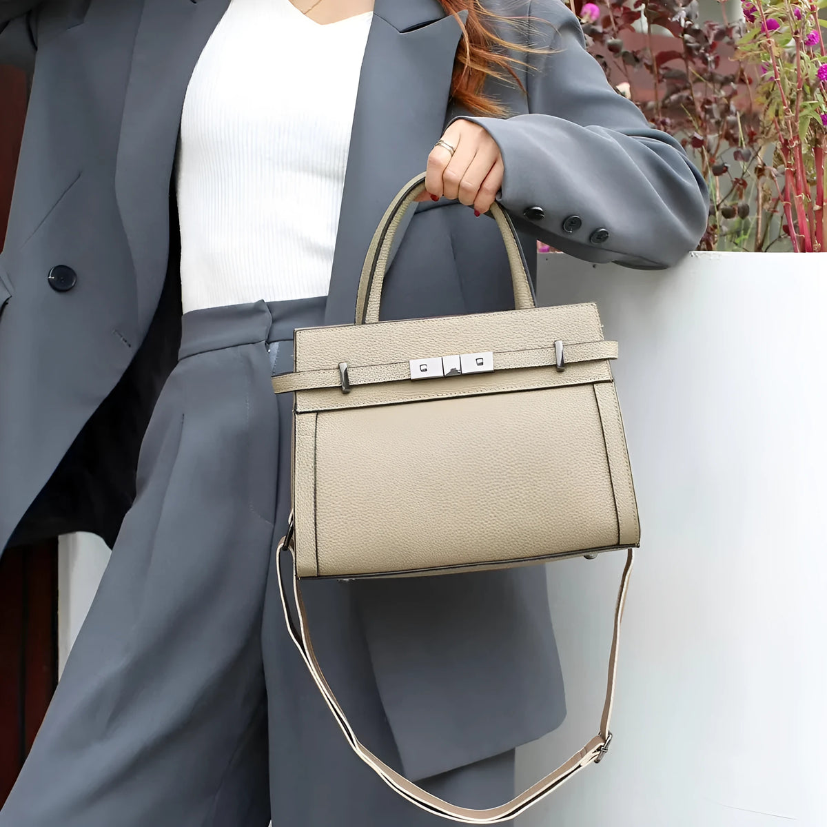 Genuine leather shoulder bag in horizontal square shape with multiple compartments and sandwich pocket design