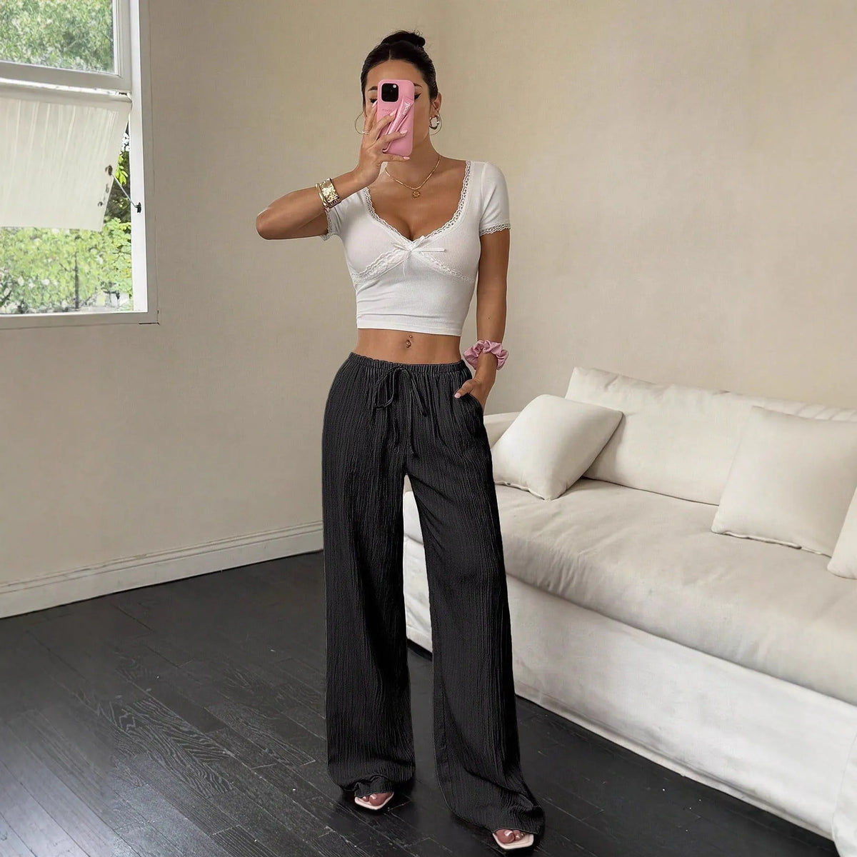 Women's wide-leg trousers with lace-up waist trim in black polyester fabric