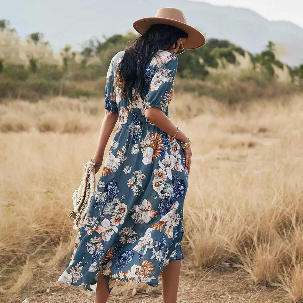 Yellow floral print summer dress with V neck and elastic waist on mannequin