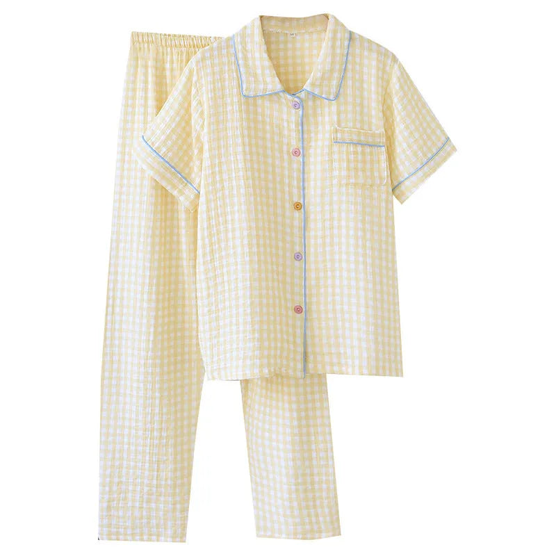 Women's loose blue Flower Sea pattern cotton gauze short-sleeve top and trouser set laid flat.