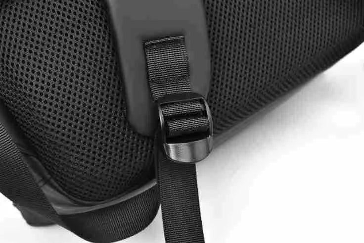 Large waterproof backpack in PU leather with sewing thread detailing, includes computer bag
