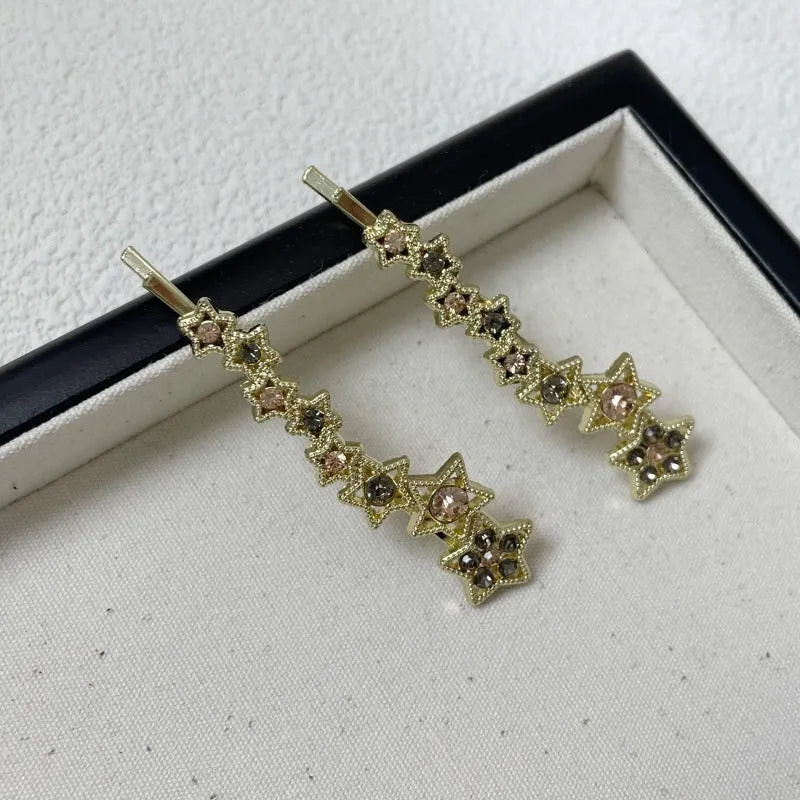 Gold electroplated rhinestone hair clip with Korean style star design for bangs