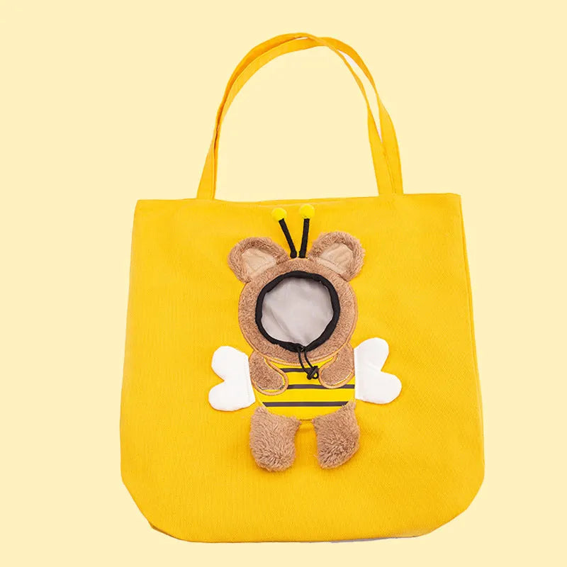 Little Bee Design canvas pet carrier shoulder bag in blue with animal pattern and adjustable side opening.
