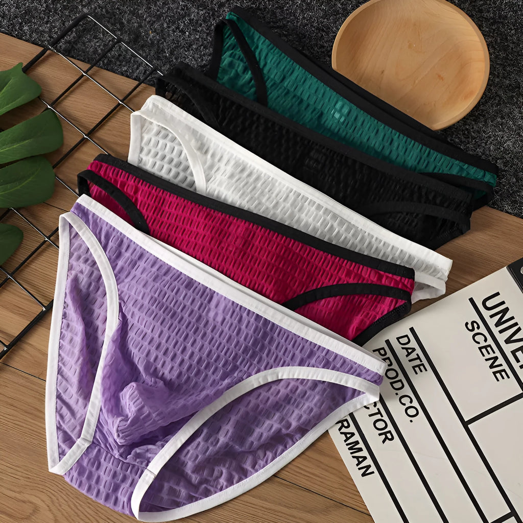 Men's low waist transparent lace underwear in multiple colours on a size chart