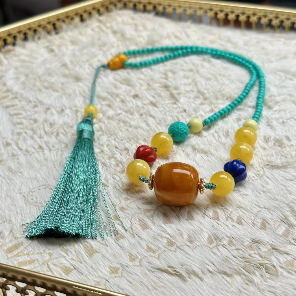 Turquoise stone mesh flower lucky pendant necklace on a ball bead chain, adjustable length.