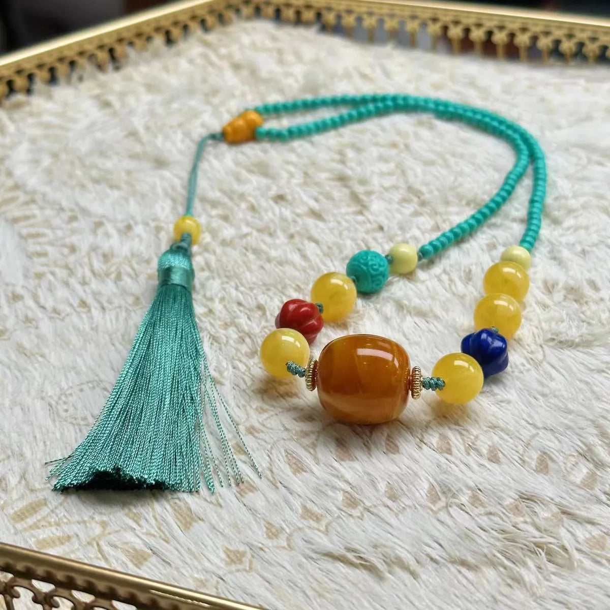 Turquoise stone mesh flower lucky pendant necklace on a ball bead chain, adjustable length.