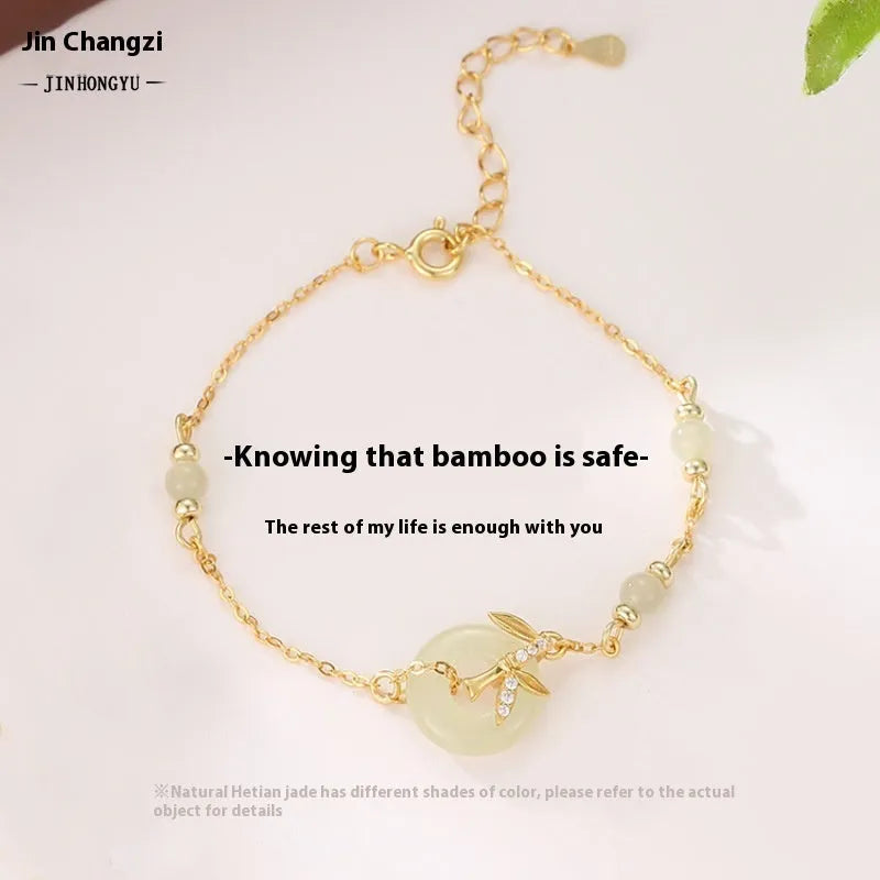 Women's antique-style 925 silver bracelet with Hetian jade and a gold-toned safety buckle clasp.