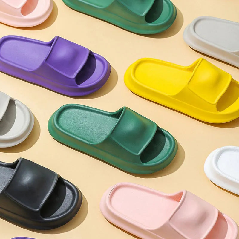 Unisex thick-soled EVA flip-flop slippers in various colours on a white background.