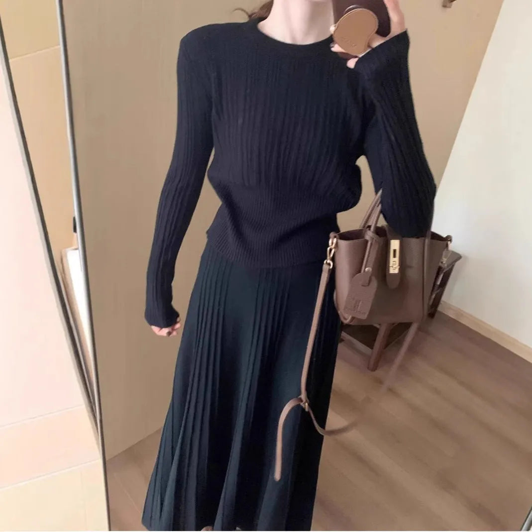 Dark grey knitted ethnic style dress suit with collage stitching, featuring a sweater and skirt.