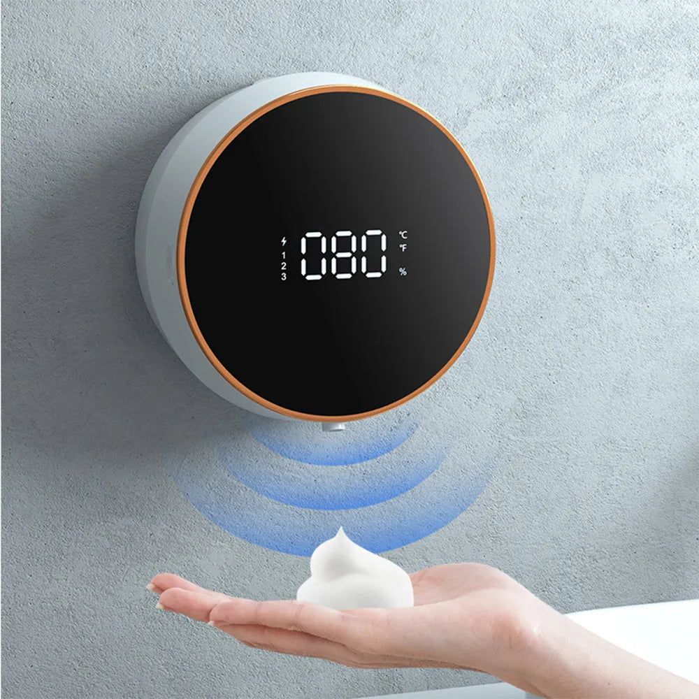 Black automatic foam soap dispenser with infrared sensor and USB charging port mounted on bathroom wall