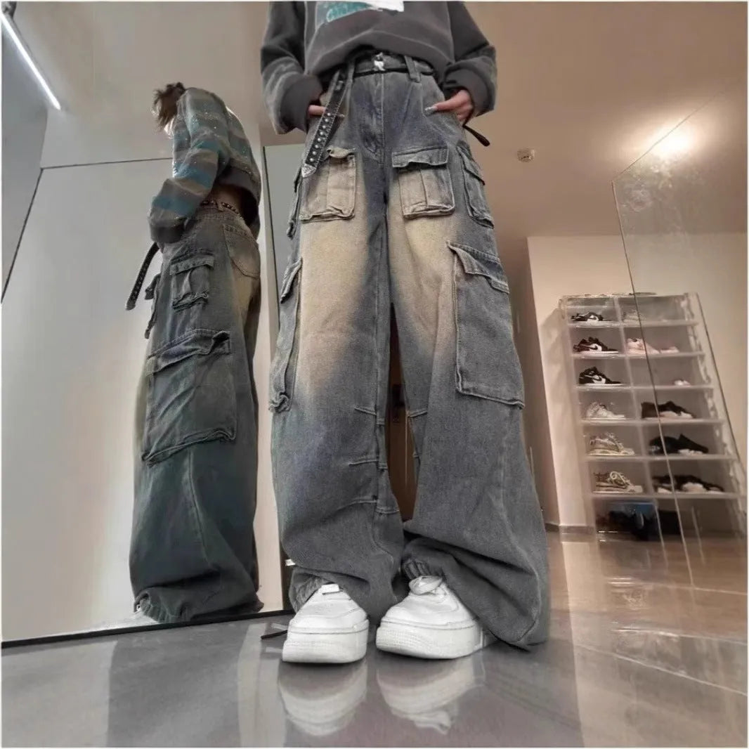 Loose multi-pocket distressed jeans with straight-leg cut and tooling style pockets