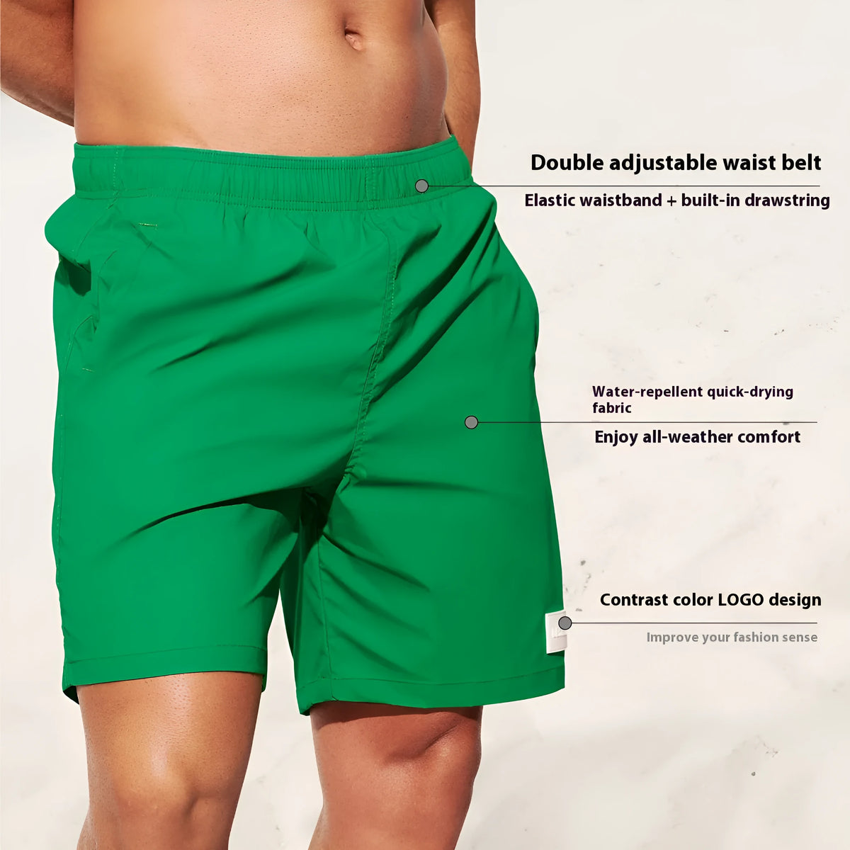 Man wearing solid green quick-drying nylon shorts with a straight leg opening on a beach.