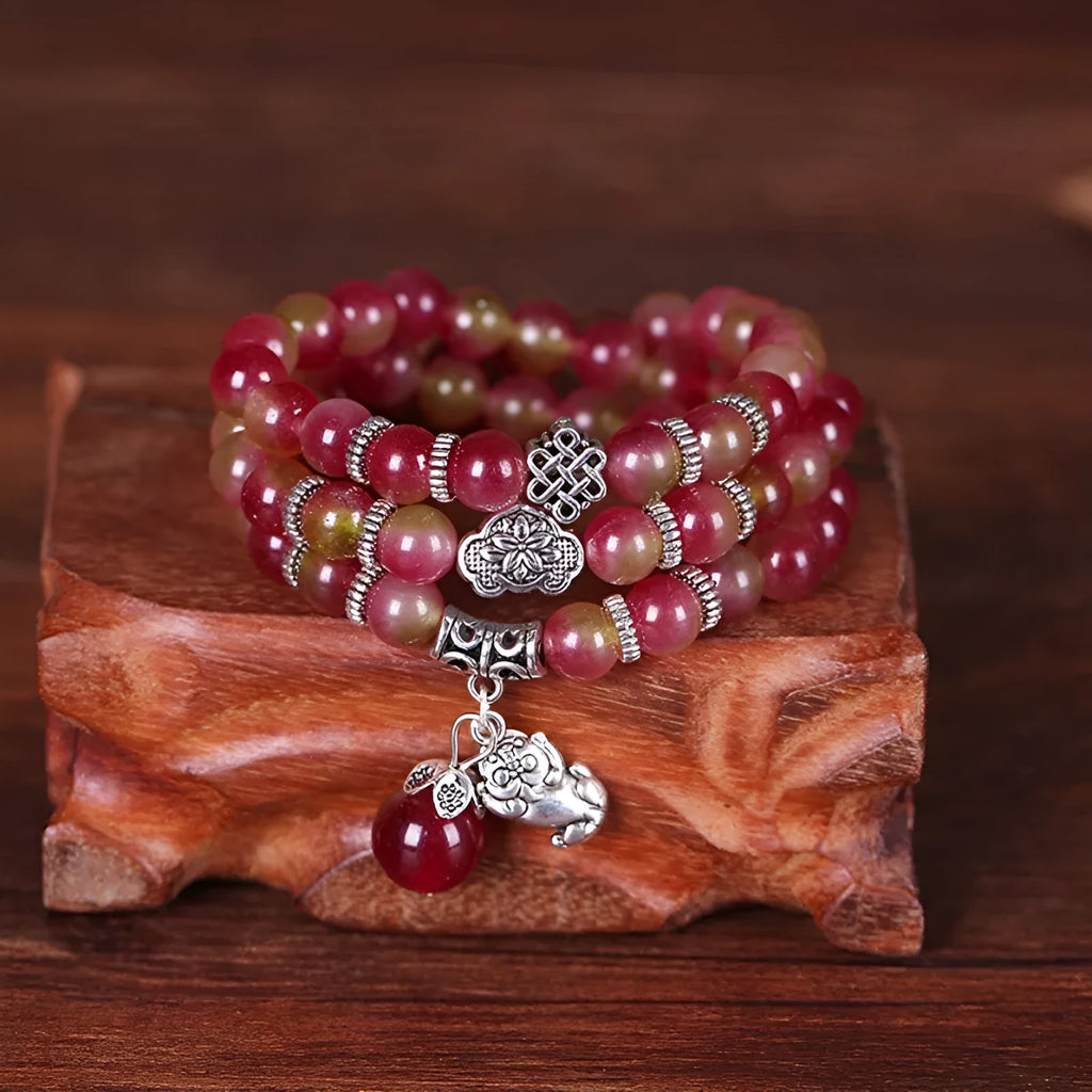 Natural watermelon crystal bracelet with Chinese knot closure and geometric beads