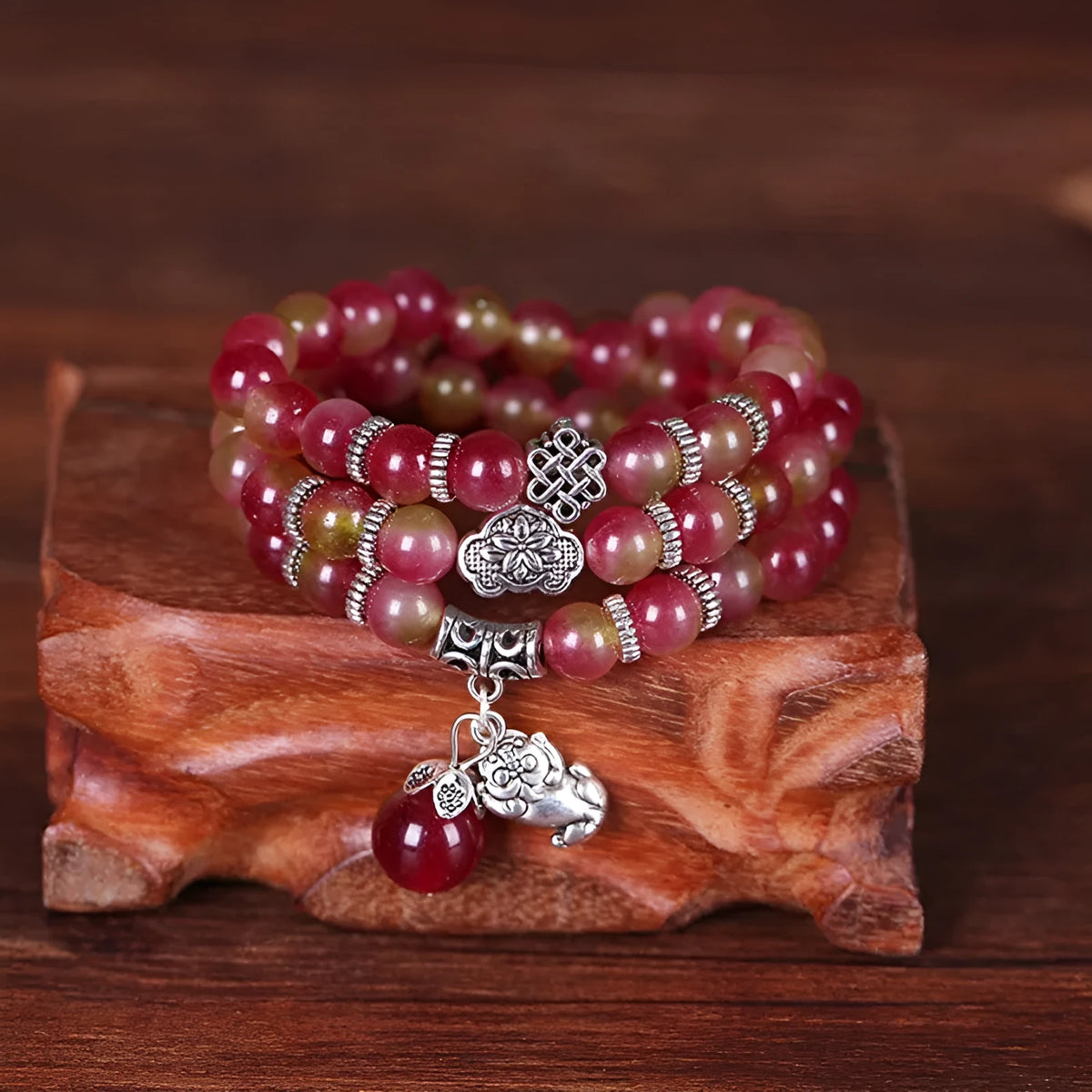 Natural watermelon crystal bracelet with Chinese knot closure and geometric beads