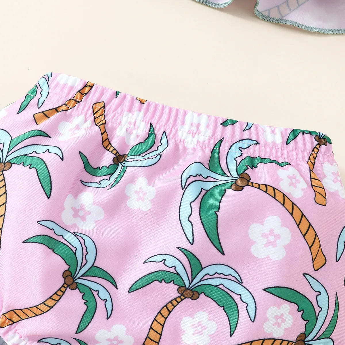White children's two-piece swimsuit set with top and beach shorts for toddlers